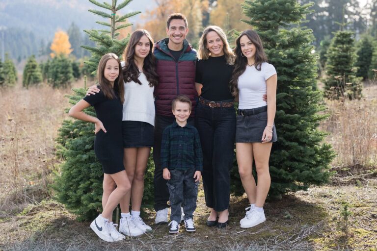 family photos by christmas trees