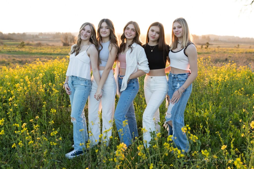 teen group of friends taking a photo outdoors